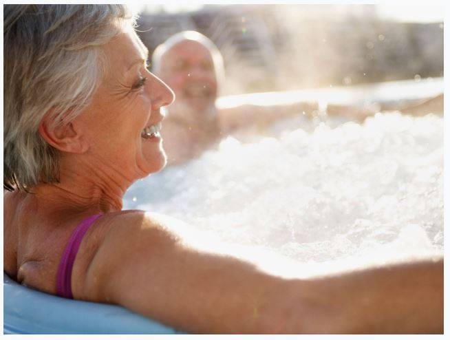 Elderly lady in hot tub